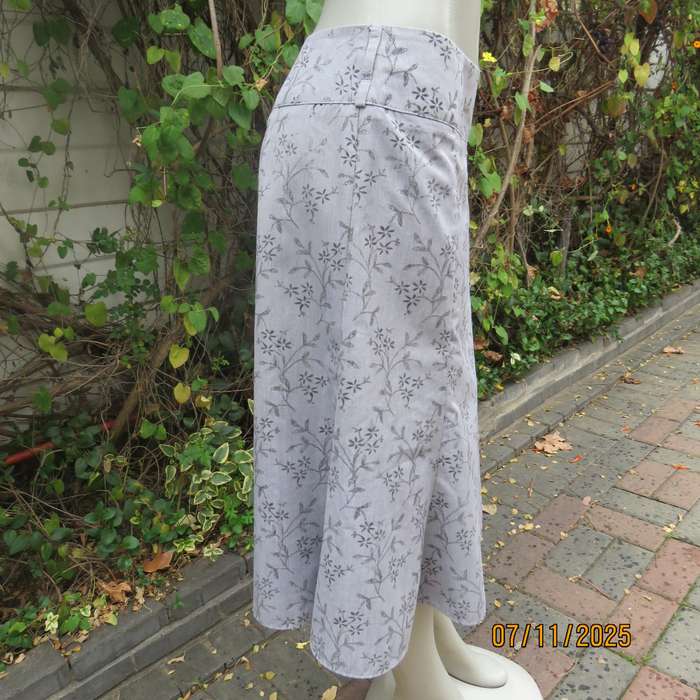 EXACT silver grey A Line paneled skirt with darker grey tiny flowers. Size 38.