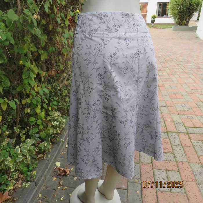 EXACT silver grey A Line paneled skirt with darker grey tiny flowers. Size 38.