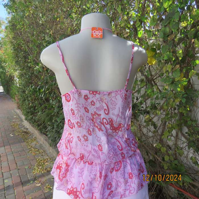 Chic slightly creased polyester pink top/red patterns. Size 34. Peplum frill.Drawstring waist.As new