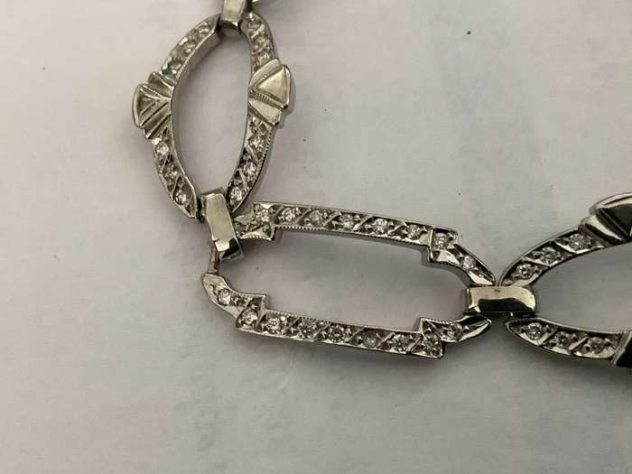 An outstanding 18 ct gold and  108 diamond oval and rectangular link bracelet.