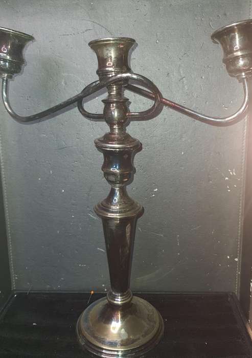 A VINTAGE THREE-CANDLE HOLDER EPNS CANDLE LIBRA STAND