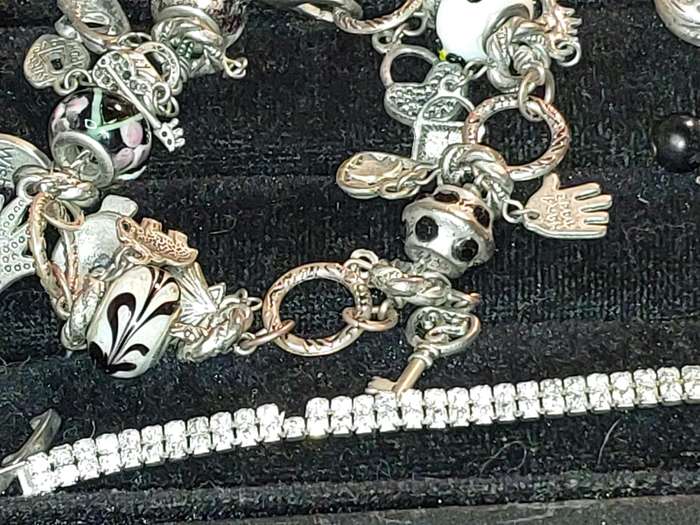 A COLLECTION OF VINTAGE COSTUME BRACELETS AND BANGLES