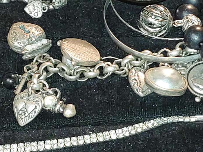 A COLLECTION OF VINTAGE COSTUME BRACELETS AND BANGLES