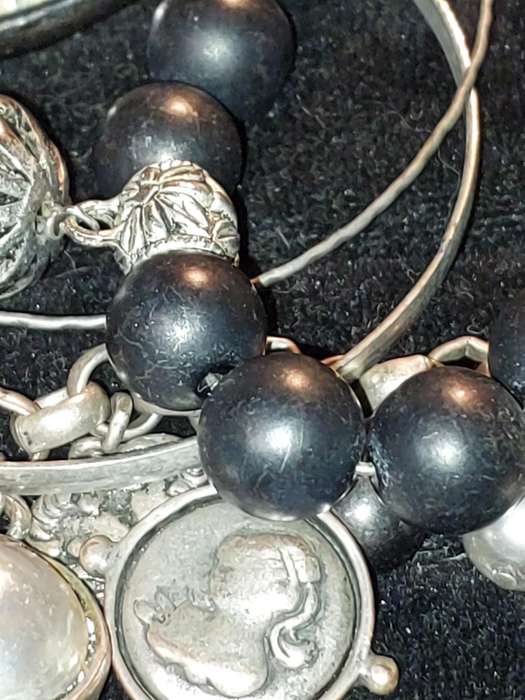 A COLLECTION OF VINTAGE COSTUME BRACELETS AND BANGLES