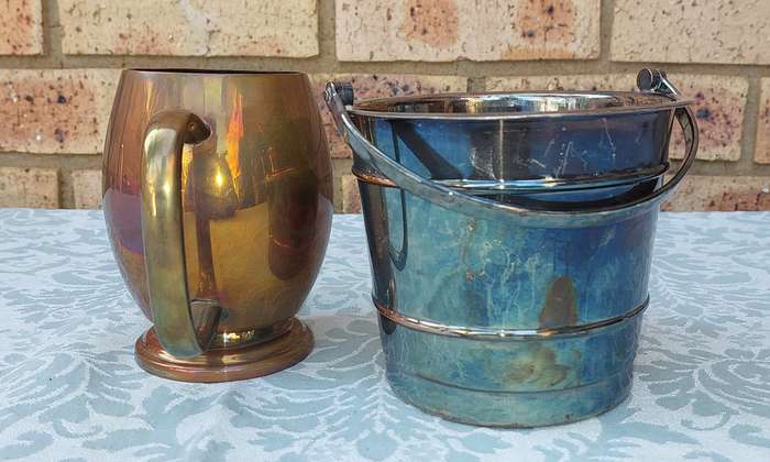 A SILVER-PLATED ICE BUCKET AND A SILVER PLATED ON COPPER PINT BEER MUG