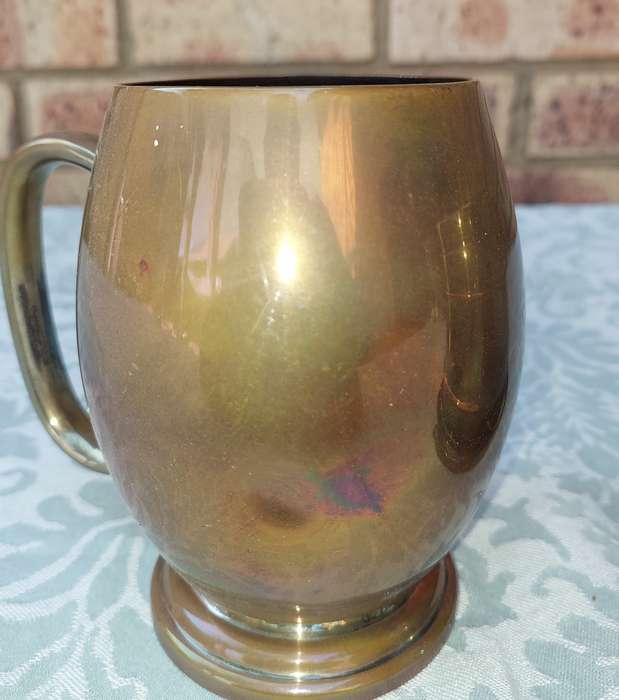 A SILVER-PLATED ICE BUCKET AND A SILVER PLATED ON COPPER PINT BEER MUG