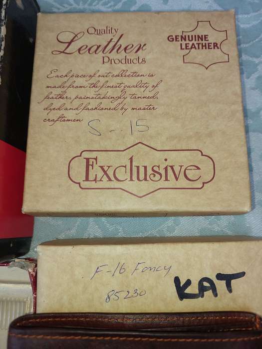 A LEATHER WALLETS AND A SET OF GROOMING BRUSHES