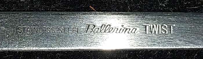 A SET OF 7 STAINLESS STEEL BELLERINA TWIST CAKE FORKS