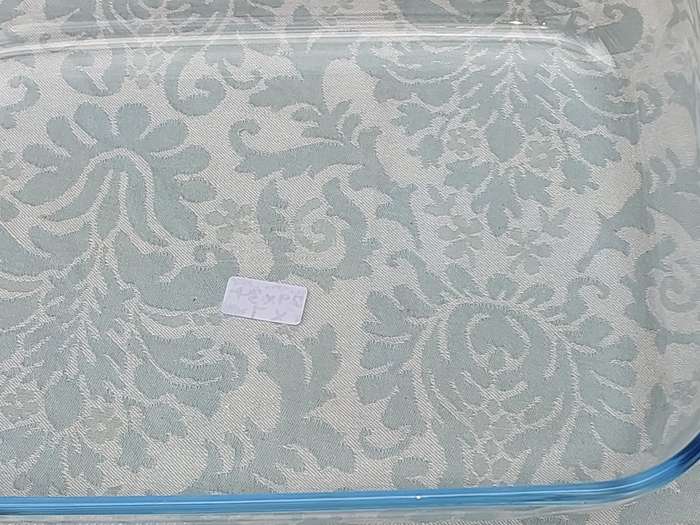 A PYREX OVEN PROOF AND MICROWAVE USE CASSEROLE SOLD AS IS
