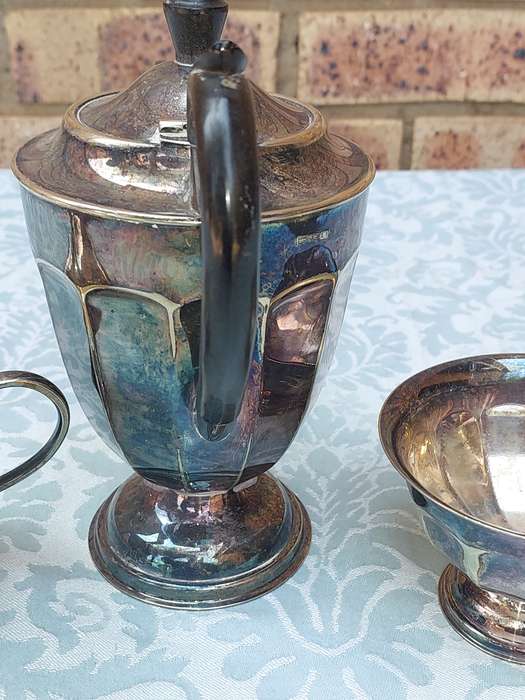 AN ANTIQUE TEA JUG SET MADE IN SHEFFIELD ENGLAND
