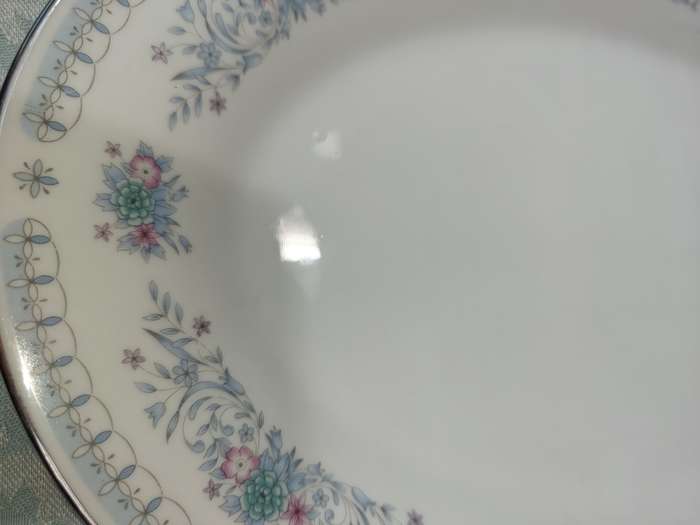 A VINTAGE PORCELAIN OVAL SHAPED WITH A SILVER INLAY PLATTER