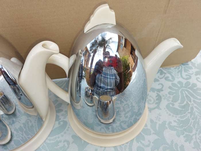 AN ANTIQUE TEA JUG SET MADE IN ENGLAND CERAMIC WITH SILVER PLATED COVERS SOLD AS