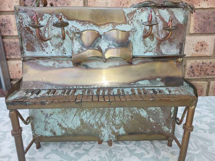 A COLLECTION OF COPPER FIGURINE ART SCULPTURES A PIANIST ,A PIANO WITH A SAXOPHONIST AND A BICYCLE