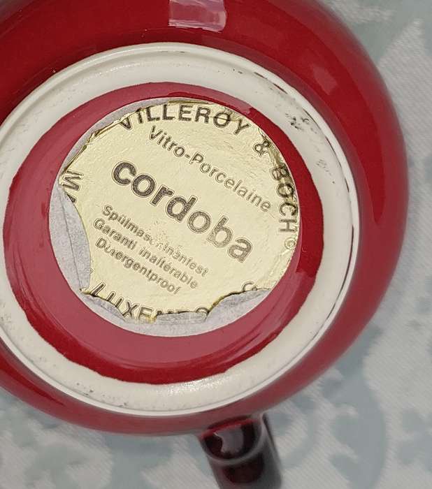 A COLLECTION OF 4 CUPS AND THREE SAUCERS BY VILLEROY &BOCH CARDOBA MADE IN LUXEMBERG RED SOLD AS IS