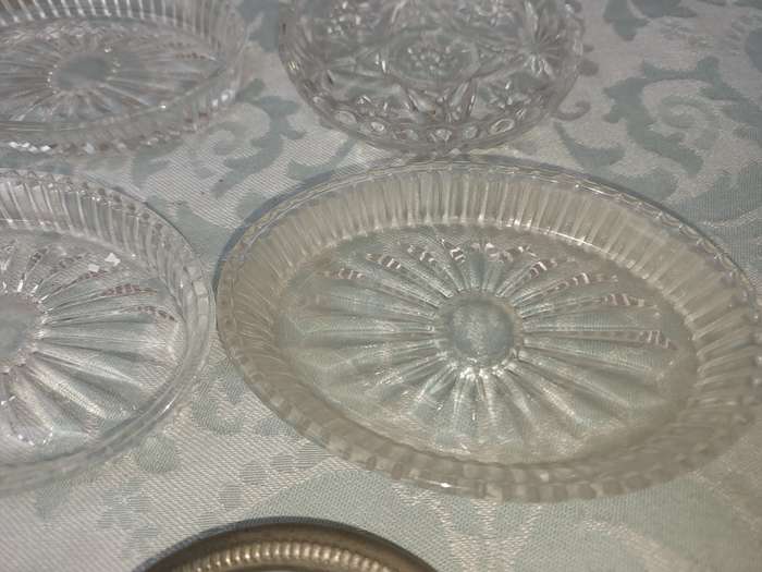 A COLLECTION OF COASTER WITH SILVER PLATED RIMS AND ORNATE CONDIMENTS OVAL MINIATURE PLATTERS