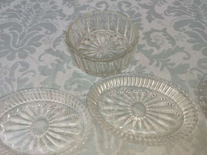 A COLLECTION OF COASTER WITH SILVER PLATED RIMS AND ORNATE CONDIMENTS OVAL MINIATURE PLATTERS