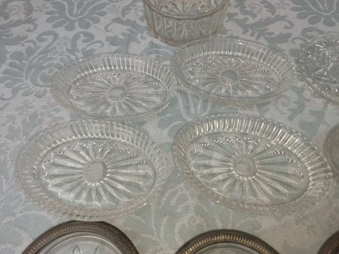 A COLLECTION OF COASTER WITH SILVER PLATED RIMS AND ORNATE CONDIMENTS OVAL MINIATURE PLATTERS