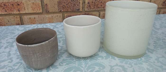 TWO CERAMIC POTS AND A GLASS FLOWER POT SOLD AS IS