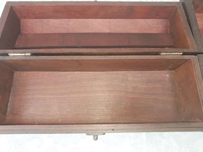 TWO ORNATE WOODEN WINE CADDYS WITH LEATHER HANDLES