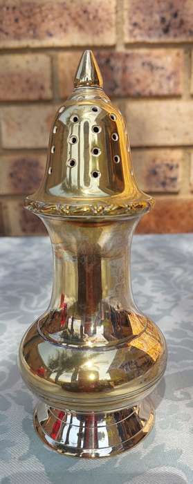 A VINTAGE SILVERPLATE ON BRONZE SUGAR SIFTER