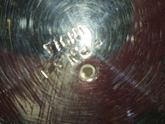 A VINTAGE SILVERPLATE ON BRONZE SUGAR SIFTER