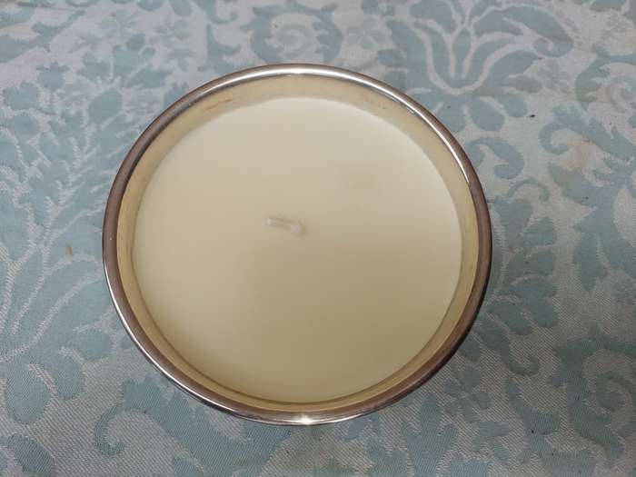 A STAINLESS STEEL BOWL CANDLE HOLDER