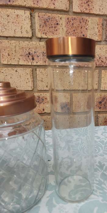 A COLLECTION OF GLASS STORAGE JARS SOLD AS IS