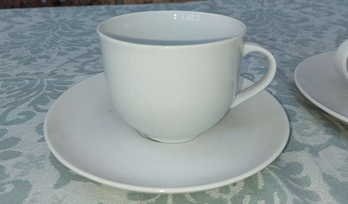 A vintage collection of 6 cups and 4 saucers white porcelain Royal Avon