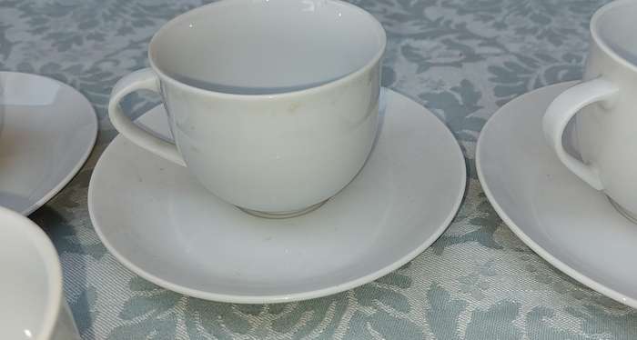 A vintage collection of 6 cups and 4 saucers white porcelain Royal Avon