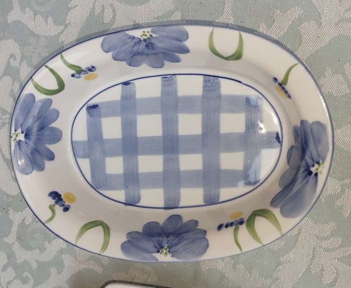 A hand-painted floral blue and white porcelain oven-proof DISHES
