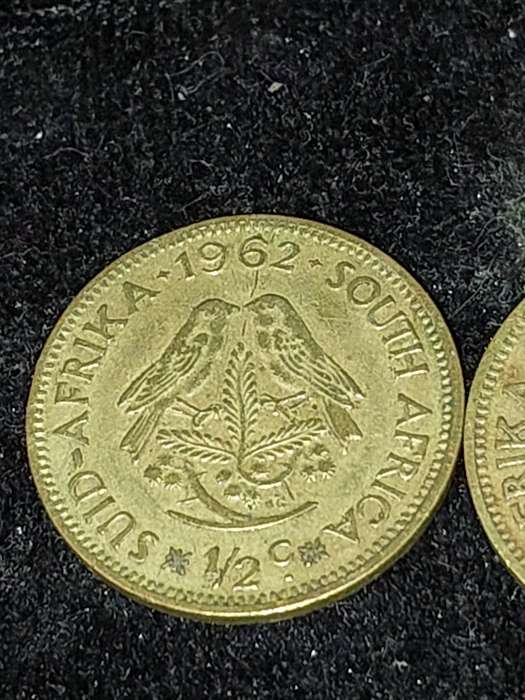 A COLLECTION OF VINTAGE AND ANTIQUE SOUTH AFRICAN COINS SOLD AS IS