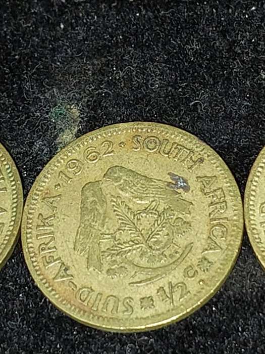 A COLLECTION OF VINTAGE AND ANTIQUE SOUTH AFRICAN COINS SOLD AS IS