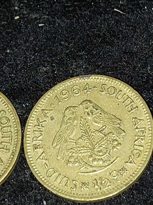A COLLECTION OF VINTAGE AND ANTIQUE SOUTH AFRICAN COINS SOLD AS IS