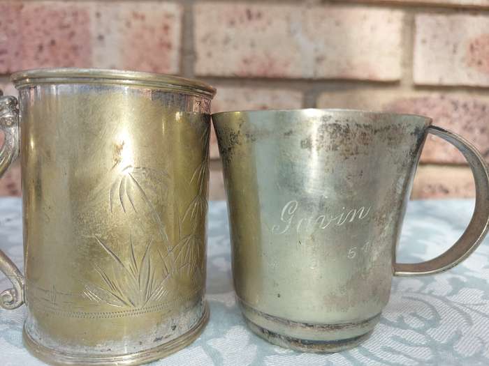 A COLLECTION OF SILVER PLATED BEER MUGS SOLD AS IS