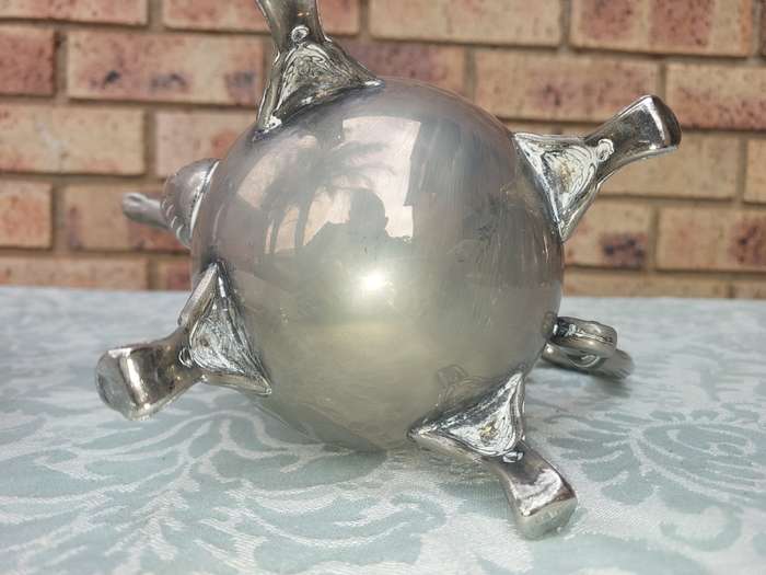 A SILVER PLATED VINTAGE TEAPOT SET SOLD AS IS