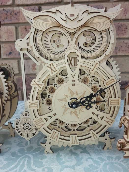 A COLLECTION OF WOODEN PROJECT WATCH OWLS AND A TRAIN ENGINE SOLD AS IS NOT TESTED