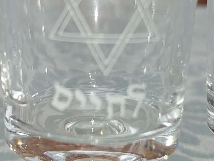 A SET OF 4 KIDDUSH GLASSES SOLD AS IS