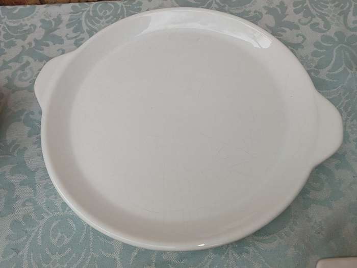 A COLLECTION OF 7 WHITE PORCELAIN SERVING PLATTERS SOLD AS IS