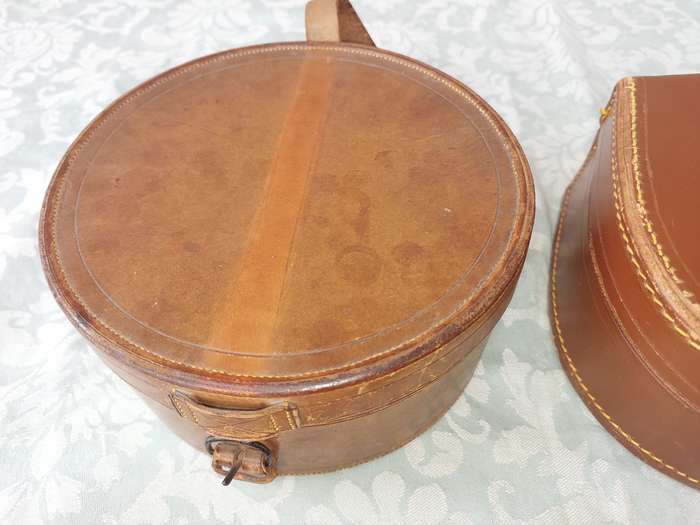 A VINTAGE AND AN ANTIQUE COLLECTION LEATHER BOUND JEWELRY BOXES SOLD AS IS