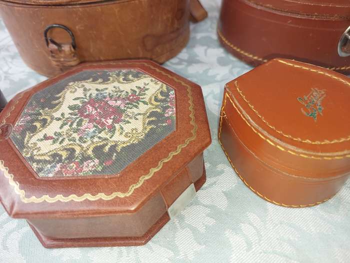 A VINTAGE AND AN ANTIQUE COLLECTION LEATHER BOUND JEWELRY BOXES SOLD AS IS