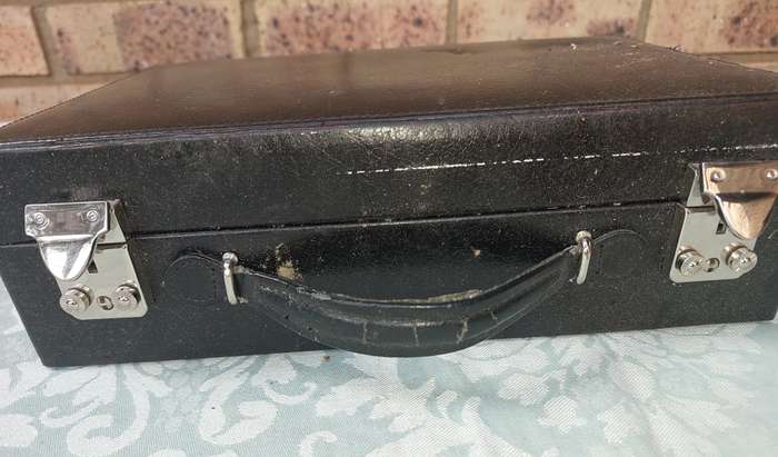 A BLACK LEATHER CASE FOR THE AVID WATCH COLLECTOR WITH KEYS  THE CASE HAS A FEW SCRATCHES SOLD AS IS