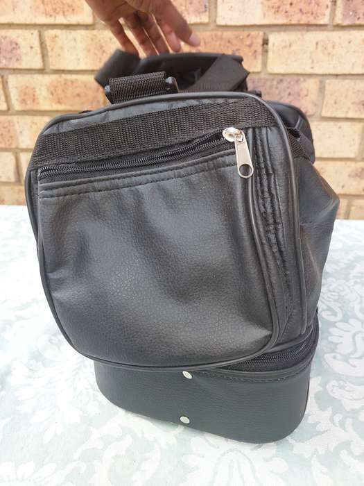 A BLACK FAUX LEATHER BAG FOR THE LADIES SOLD AS IS