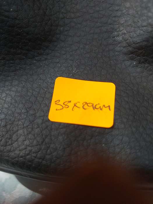A BLACK FAUX LEATHER BAG FOR THE LADIES SOLD AS IS