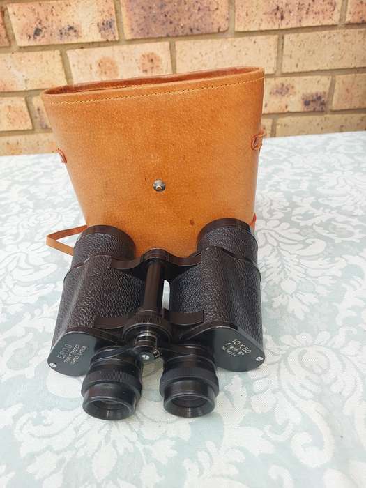 A VINTAGE ROS TRIPLE COATED TESTED OIOTIC 10X 50 BINOCULARS SOLD AS IS