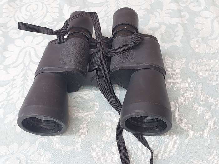 A USED 60X60 BINOCULARS SOLD AS IS