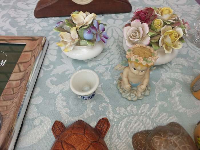 A COLLECTION OF FIGURINES AND A SILVER PLATED PHOTO FRAME SOLD AS IS