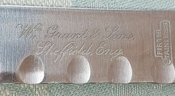 A SET OF FIVE VINTAGE BONE HANDLED STEAK KNIVES