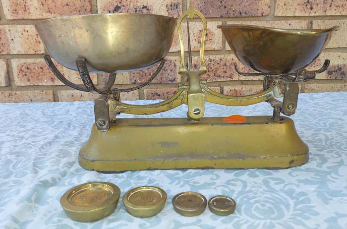 A VINTAGE CAST IRON AND BRONZE SCALE WITH THE BRONZE WEIGHTS SOLD AS IS