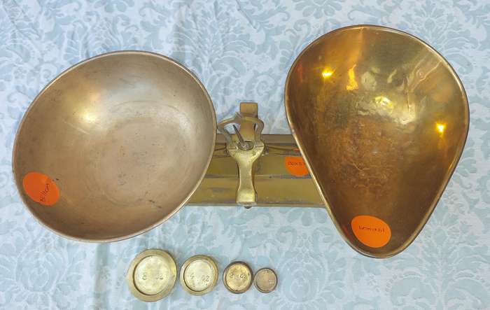 A VINTAGE CAST IRON AND BRONZE SCALE WITH THE BRONZE WEIGHTS SOLD AS IS