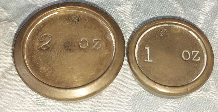 A VINTAGE CAST IRON AND BRONZE SCALE WITH THE BRONZE WEIGHTS SOLD AS IS